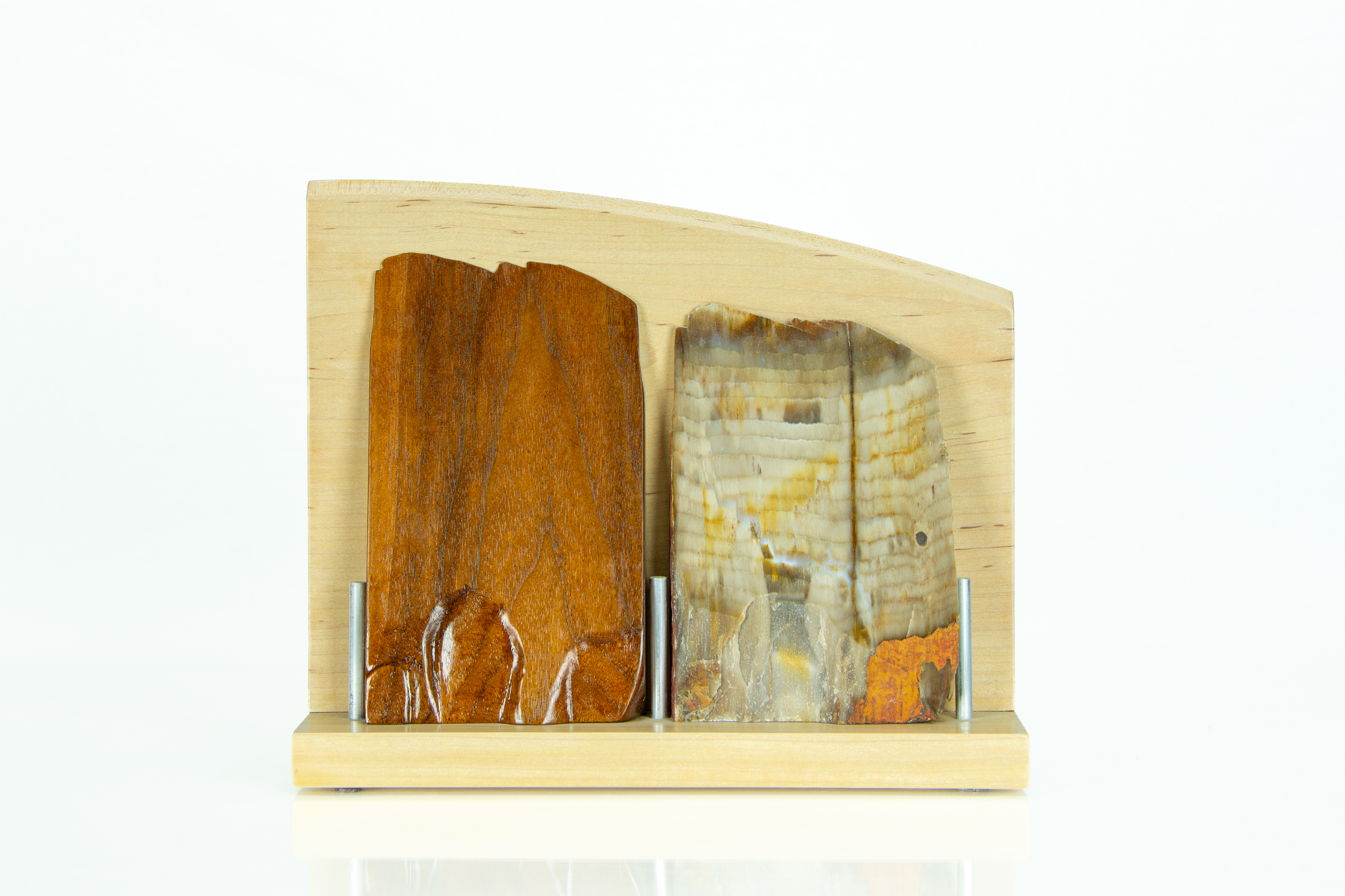 Form + Fossil II — banded petrified wood and hand-carved walnut on a maple base